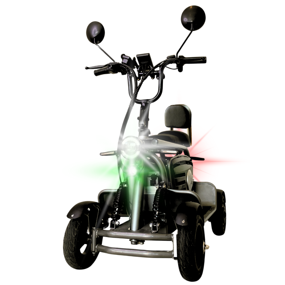 Three-wheeled mobility scooter facing forward with a padded seat, handlebar controls, a green front headlight, and red rear lights.